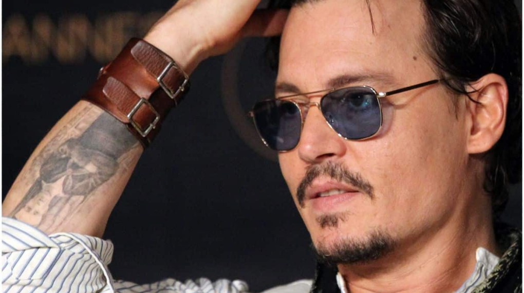 whose name did johnny depp have tattooed on his arm in 1990?